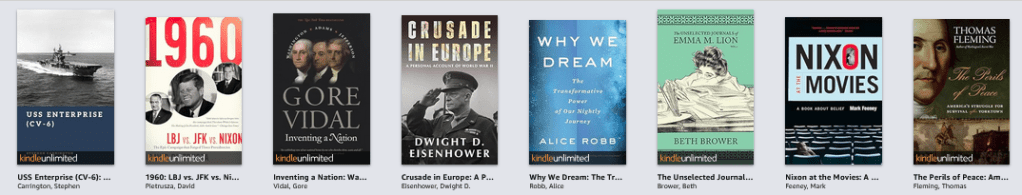 A row of book titles consisting of USS Enterprise CV-6, 1960 - LBJ vs JFK vs NIXON,  Inventing a Nation, Crusade in Europe, Why We Dream, Nixon at the Movies, and The Perils of Peace